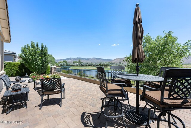 3579 Long Dr, Minden, NV 89423 - view of patio / terrace featuring a water and mountain view and outdoor dining area