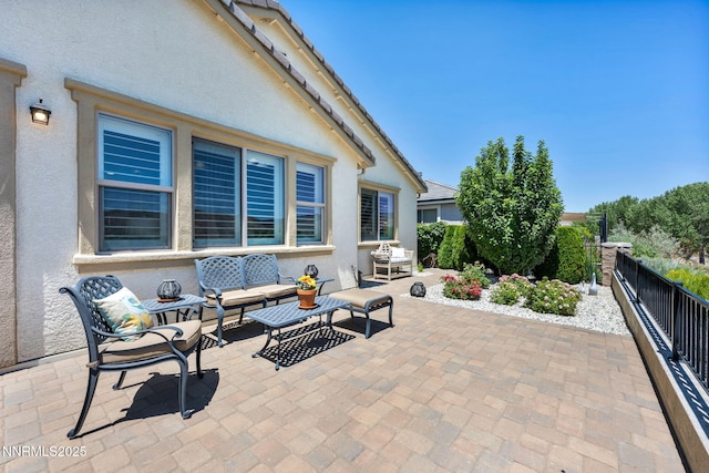 3579 Long Dr, Minden, NV 89423 - fenced backyard with a patio and outdoor lounge area