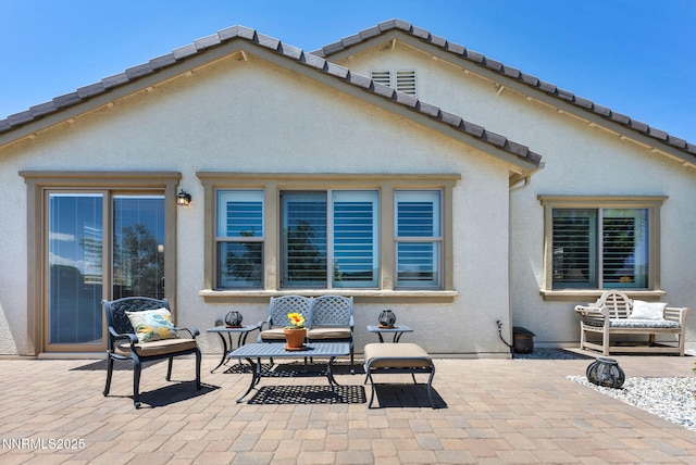 3579 Long Dr, Minden, NV 89423 - rear view of property with a patio, stucco siding, and a tiled roof