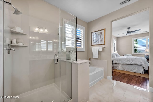 3579 Long Dr, Minden, NV 89423 - bathroom with ensuite bath, a stall shower, a bath, and ceiling fan