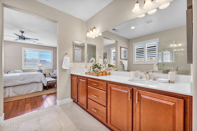 3579 Long Dr, Minden, NV 89423 - bathroom featuring double vanity, a ceiling fan, and connected bathroom