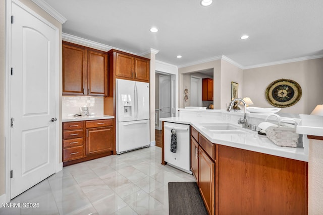 3579 Long Dr, Minden, NV 89423 - kitchen featuring white appliances, ornamental molding, light countertops, recessed lighting, and decorative backsplash