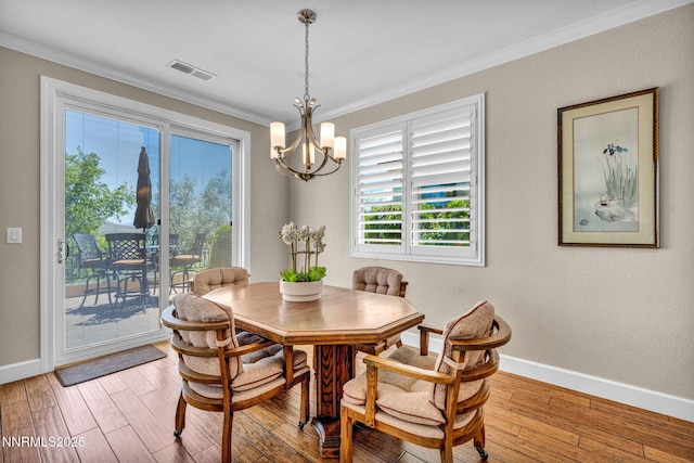 3579 Long Dr, Minden, NV 89423 - dining space featuring ornamental molding, a chandelier, and wood finished floors