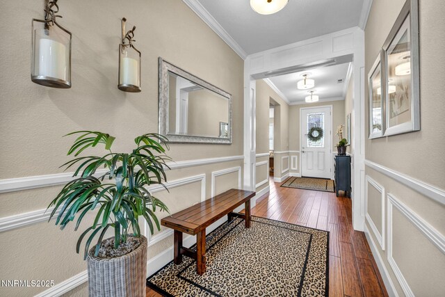 3579 Long Dr, Minden, NV 89423 - entrance foyer with crown molding, wood-type flooring, a decorative wall, and wainscoting