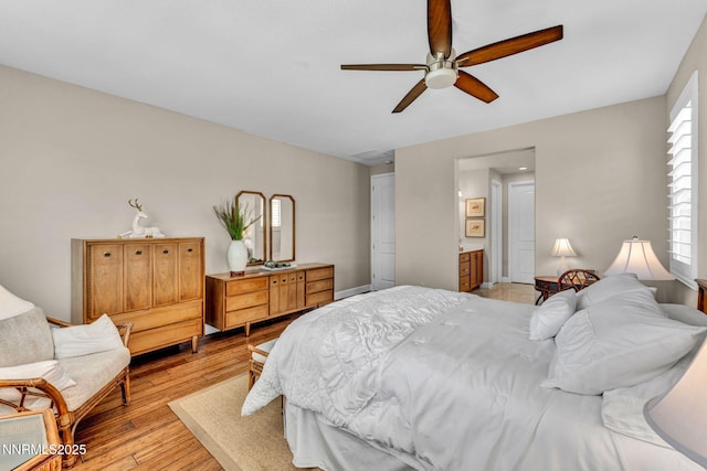 3579 Long Dr, Minden, NV 89423 - bedroom featuring light wood-style flooring, ceiling fan, and connected bathroom