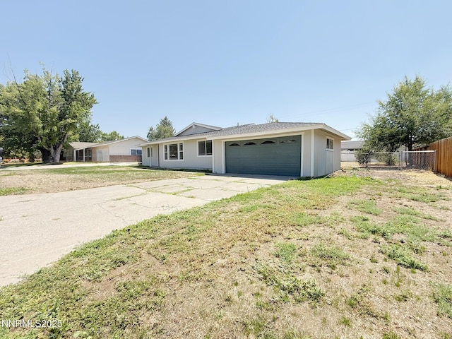 1568 County Rd, Minden, NV 89423 - ranch-style house featuring concrete driveway and a garage