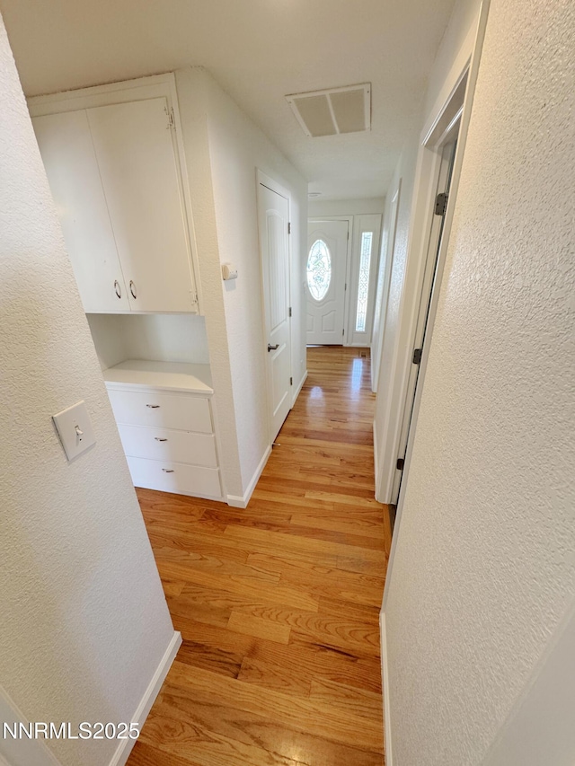 1568 County Rd, Minden, NV 89423 - hallway with light wood-type flooring and a textured wall