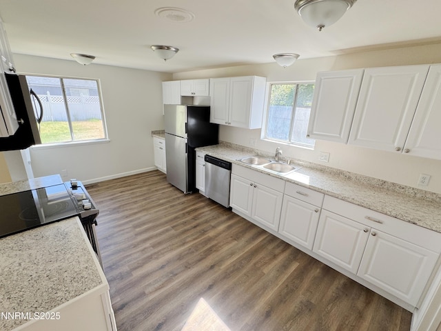 1568 County Rd, Minden, NV 89423 - kitchen featuring appliances with stainless steel finishes, wood finished floors, and white cabinets