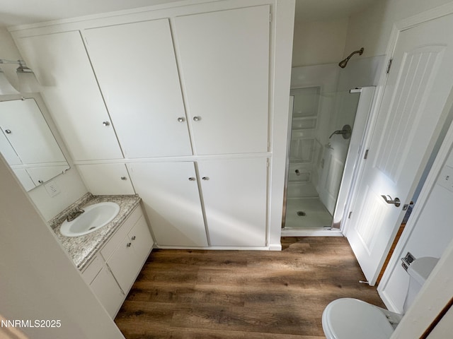 1568 County Rd, Minden, NV 89423 - full bathroom featuring wood finished floors, a shower stall, and vanity