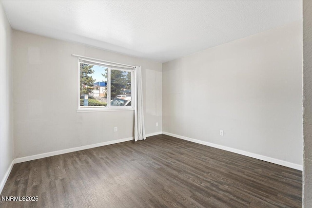 2555 Clear Acre Ln Apt 13, Reno, NV 89512 - unfurnished room with dark wood-style floors and baseboards