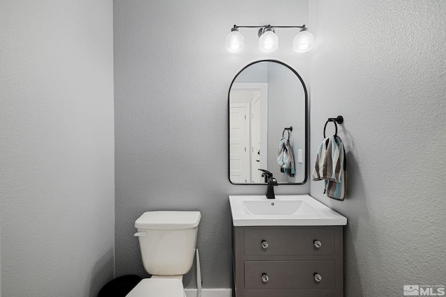 1585 Foster Dr, Reno, NV 89509 - half bathroom featuring vanity and toilet