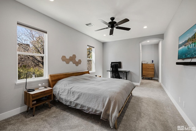 1585 Foster Dr, Reno, NV 89509 - bedroom with arched walkways, multiple windows, recessed lighting, carpet, and ceiling fan