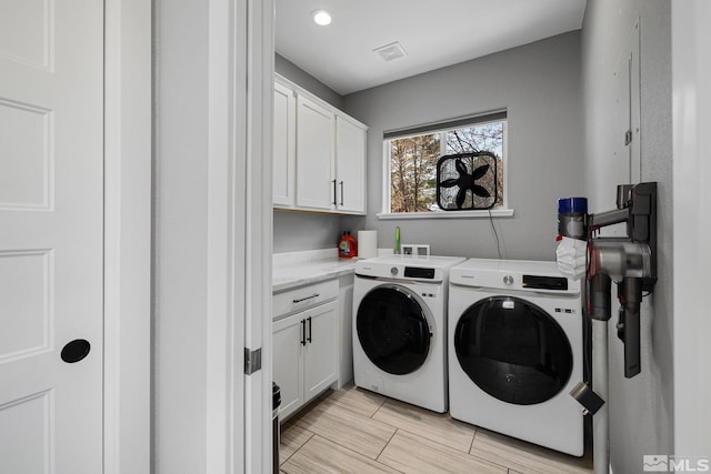 1585 Foster Dr, Reno, NV 89509 - laundry area featuring washer and dryer, cabinet space, and recessed lighting