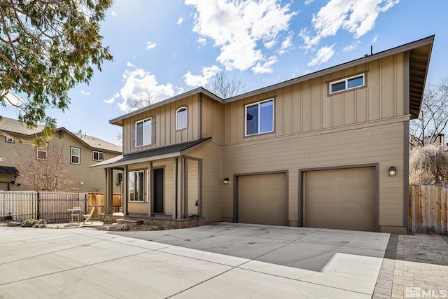 1585 Foster Dr, Reno, NV 89509 - view of front of property featuring board and batten siding, concrete driveway, and a garage