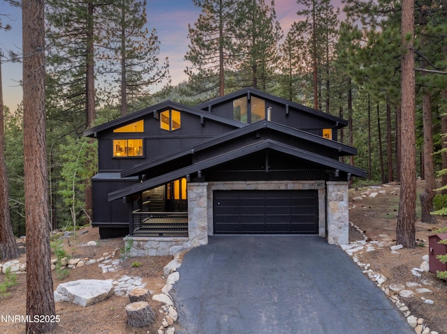 960 Apollo Way, Incline Village, NV 89451 - contemporary house featuring stone siding and driveway