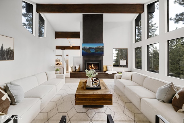 960 Apollo Way, Incline Village, NV 89451 - living room with a high ceiling, beam ceiling, plenty of natural light, and a fireplace