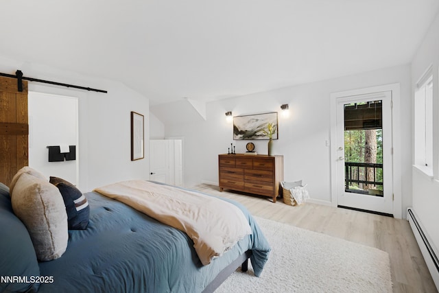 960 Apollo Way, Incline Village, NV 89451 - bedroom with a baseboard radiator, wood finished floors, access to exterior, and a barn door