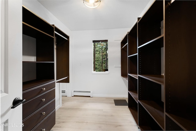 960 Apollo Way, Incline Village, NV 89451 - walk in closet with light wood-style floors and a baseboard heating unit