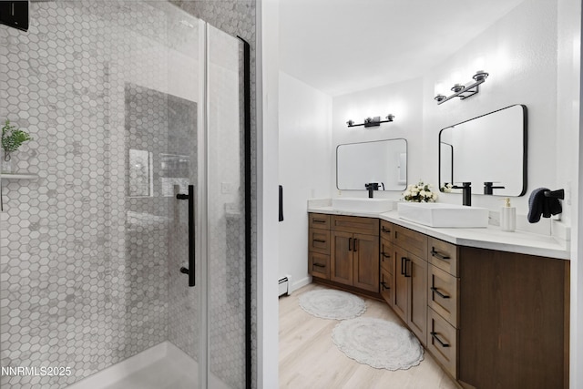 960 Apollo Way, Incline Village, NV 89451 - bathroom featuring double vanity, a stall shower, and wood finished floors