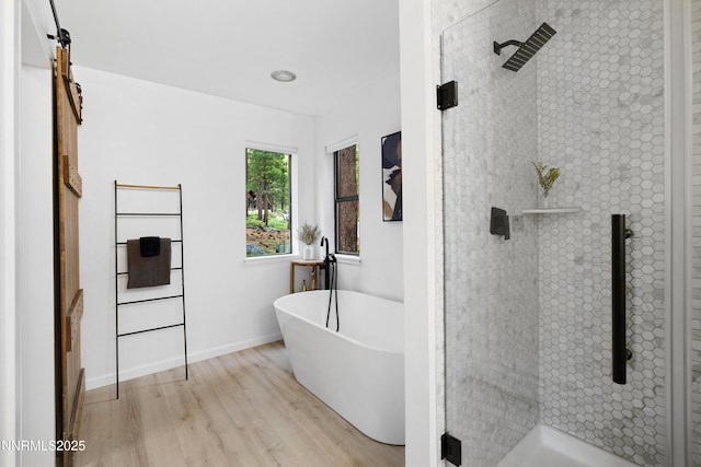 960 Apollo Way, Incline Village, NV 89451 - bathroom with a stall shower, wood finished floors, and a freestanding bath