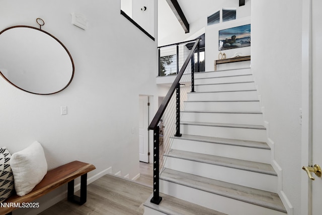 960 Apollo Way, Incline Village, NV 89451 - staircase with wood finished floors, beamed ceiling, and a high ceiling