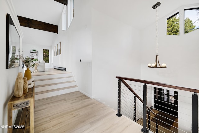 960 Apollo Way, Incline Village, NV 89451 - stairs featuring a chandelier, wood finished floors, and high vaulted ceiling