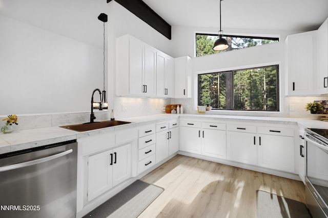 960 Apollo Way, Incline Village, NV 89451 - kitchen with stainless steel dishwasher, white electric stove, backsplash, light wood-style flooring, and white cabinetry
