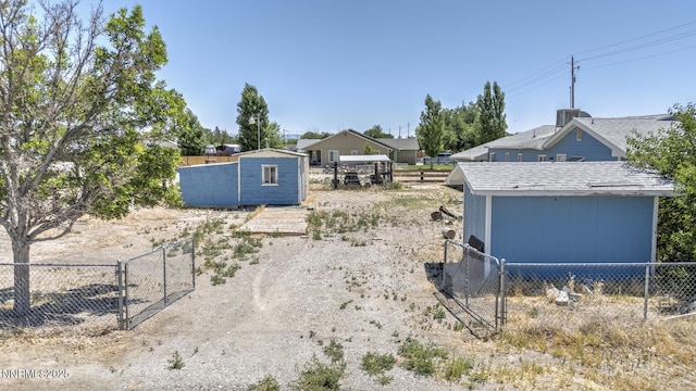 3480 York Ln, Fallon, NV 89406 - view of yard with a storage unit and a gate