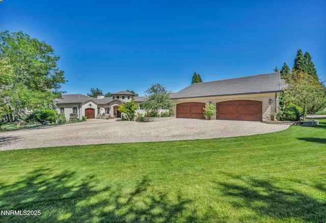 3820 Frost Ln, Reno, NV 89511 - view of front facade with decorative driveway, a front lawn, and a garage