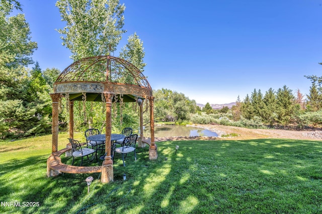 3820 Frost Ln, Reno, NV 89511 - view of grassy yard with a gazebo and a water view