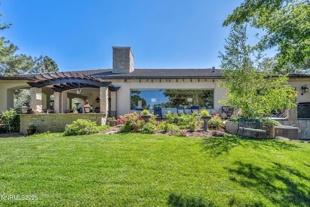 3820 Frost Ln, Reno, NV 89511 - rear view of property with a chimney, stucco siding, a lawn, and a pergola