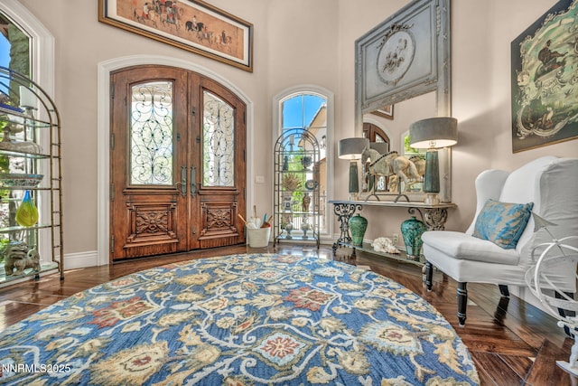 3820 Frost Ln, Reno, NV 89511 - entryway featuring french doors, a towering ceiling, and wood finished floors