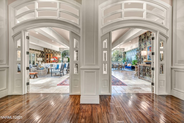 3820 Frost Ln, Reno, NV 89511 - foyer with dark wood-type flooring, arched walkways, and a high ceiling