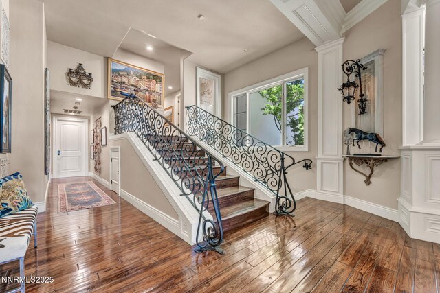 3820 Frost Ln, Reno, NV 89511 - stairs featuring decorative columns and hardwood / wood-style flooring