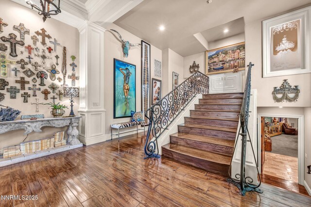3820 Frost Ln, Reno, NV 89511 - stairs featuring hardwood / wood-style flooring, ornate columns, and recessed lighting