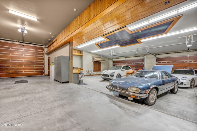 3820 Frost Ln, Reno, NV 89511 - garage featuring a garage door opener and wooden walls
