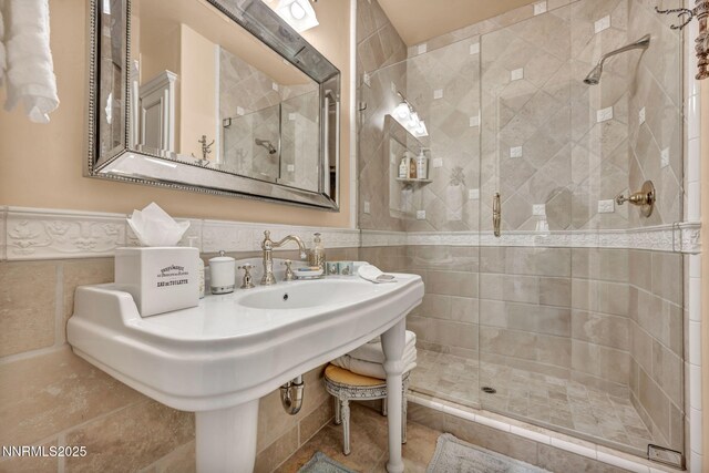 3820 Frost Ln, Reno, NV 89511 - full bath featuring a stall shower, tile walls, and wainscoting
