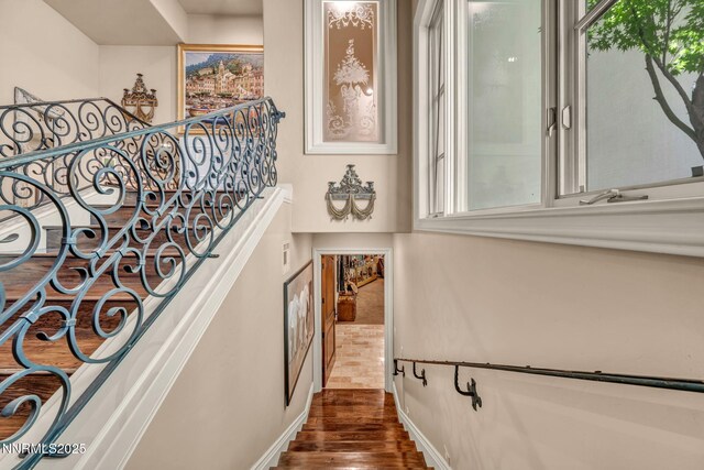 3820 Frost Ln, Reno, NV 89511 - staircase featuring wood finished floors and baseboards