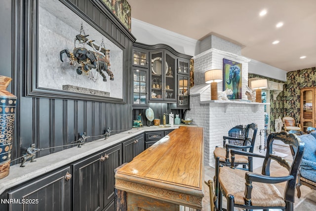3820 Frost Ln, Reno, NV 89511 - bar area featuring recessed lighting, a fireplace, and ornamental molding