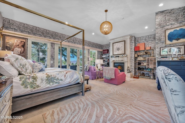 3820 Frost Ln, Reno, NV 89511 - carpeted bedroom featuring wallpapered walls, french doors, multiple windows, recessed lighting, and a chandelier