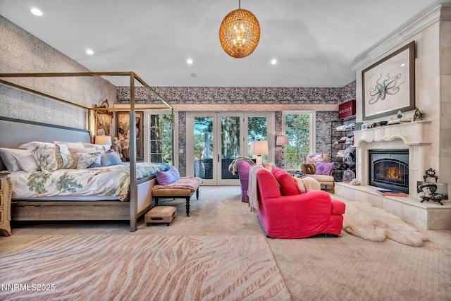 3820 Frost Ln, Reno, NV 89511 - bedroom featuring access to outside, a chandelier, a tiled fireplace, french doors, and carpet flooring