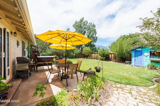 644 Carmel Way, Gardnerville, NV 89460 - fenced backyard with a patio area, a storage unit, outdoor dining area, and area for grilling