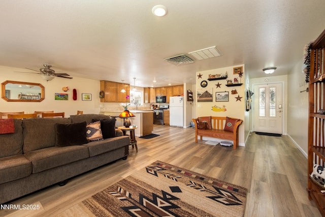 644 Carmel Way, Gardnerville, NV 89460 - living room with light wood finished floors and ceiling fan