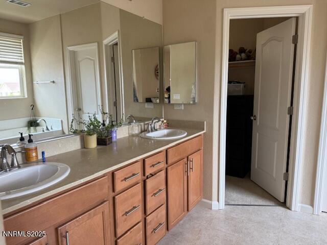 1108 Tuscan Ct, Minden, NV 89423 - bathroom featuring double vanity and a bath