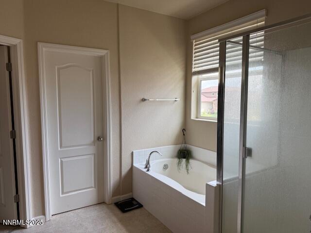 1108 Tuscan Ct, Minden, NV 89423 - bathroom with a bath and a shower with shower door