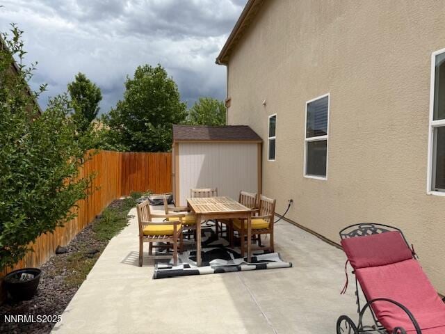 1108 Tuscan Ct, Minden, NV 89423 - view of patio featuring outdoor dining space and a shed
