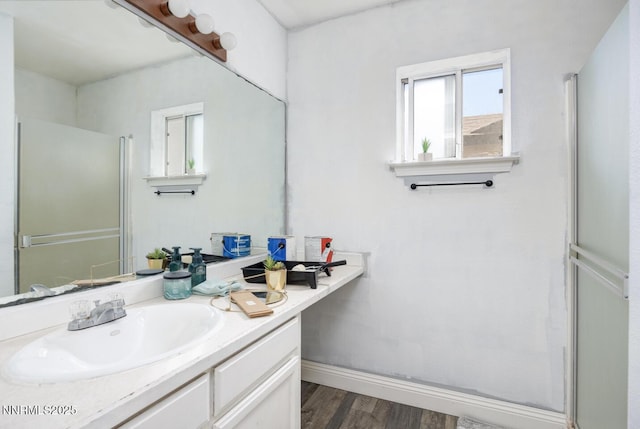 1866 Albert St, Fallon, NV 89406 - bathroom featuring vanity, wood finished floors, and a shower with door