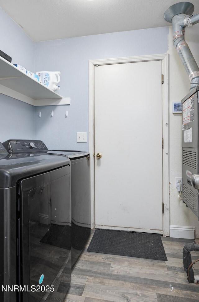1866 Albert St, Fallon, NV 89406 - laundry area featuring washer and dryer and wood finished floors