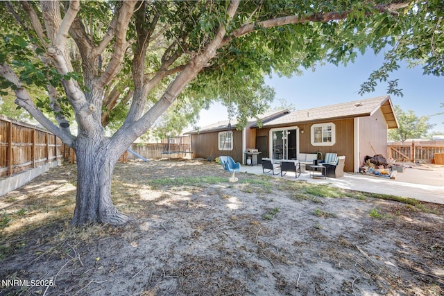 1866 Albert St, Fallon, NV 89406 - rear view of property featuring an outdoor hangout area, a fenced backyard, a patio, and french doors