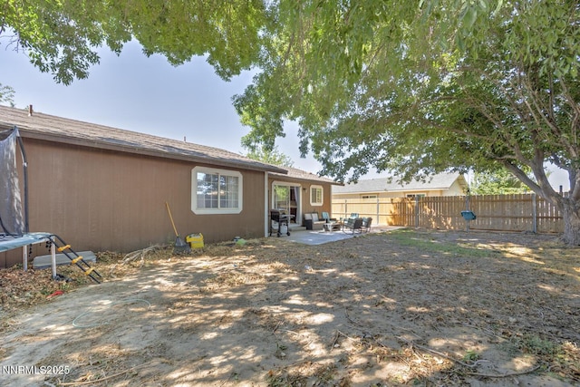 1866 Albert St, Fallon, NV 89406 - rear view of property with a fenced backyard, a patio, and an outdoor living space